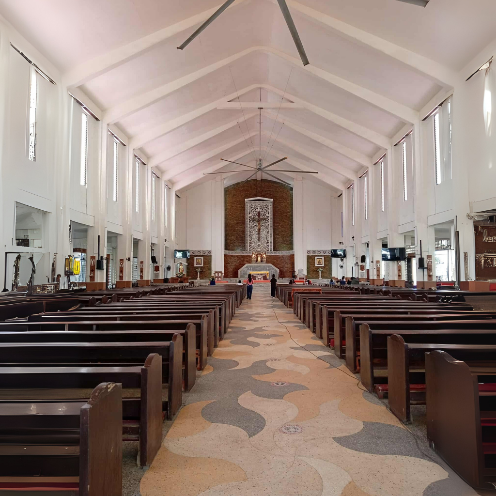 Interior of Sto. Niño Cathedral with rows of pews and altar