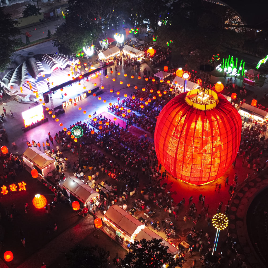 Tandig Festival performers dancing with bamboo poles