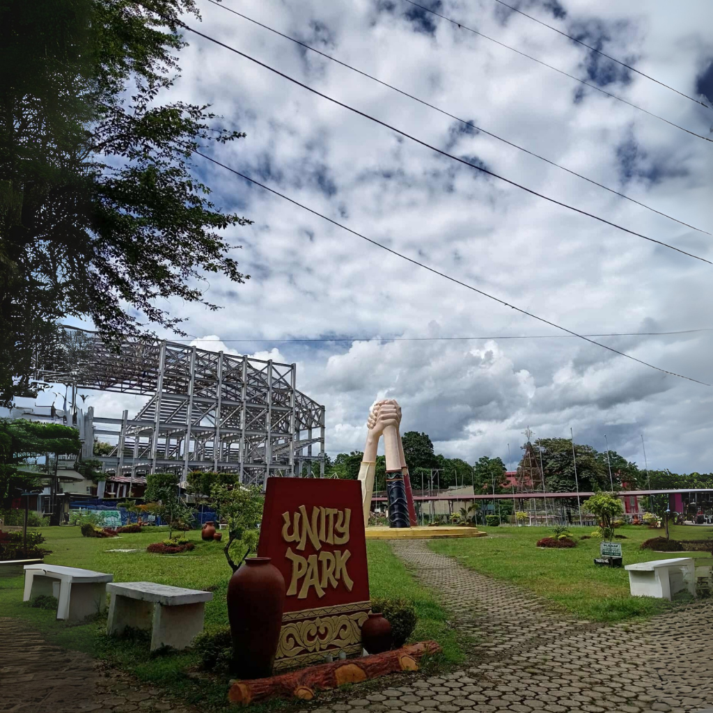 Unity Park monument with cross and historical markers